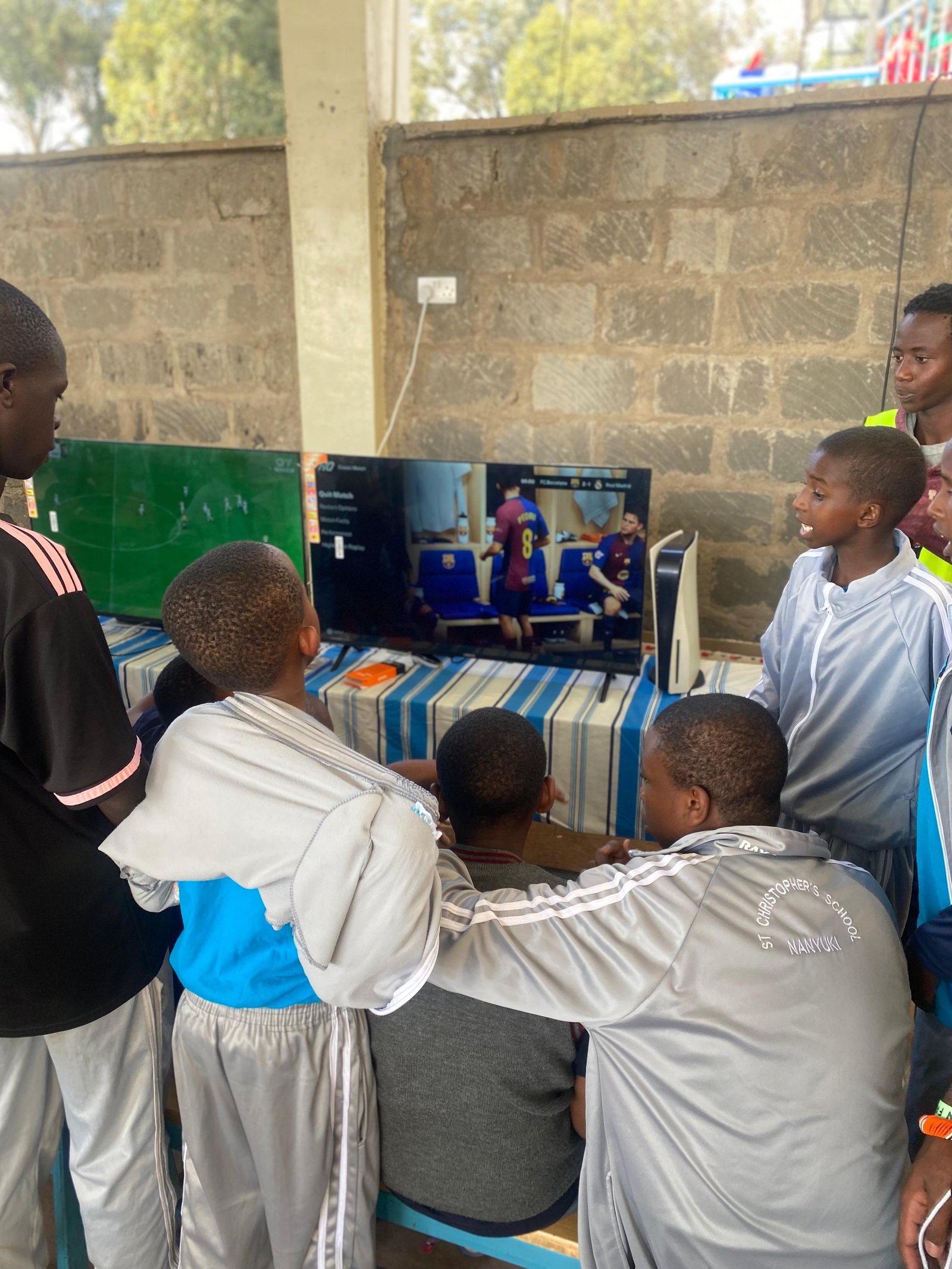 Kids enjoying football and VR gaming